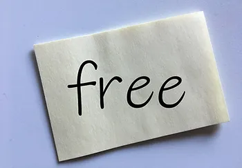 A note with the word "free" written on it, representing Speedy Scoop’s referral rewards program in Central Indiana to earn a free scoop.